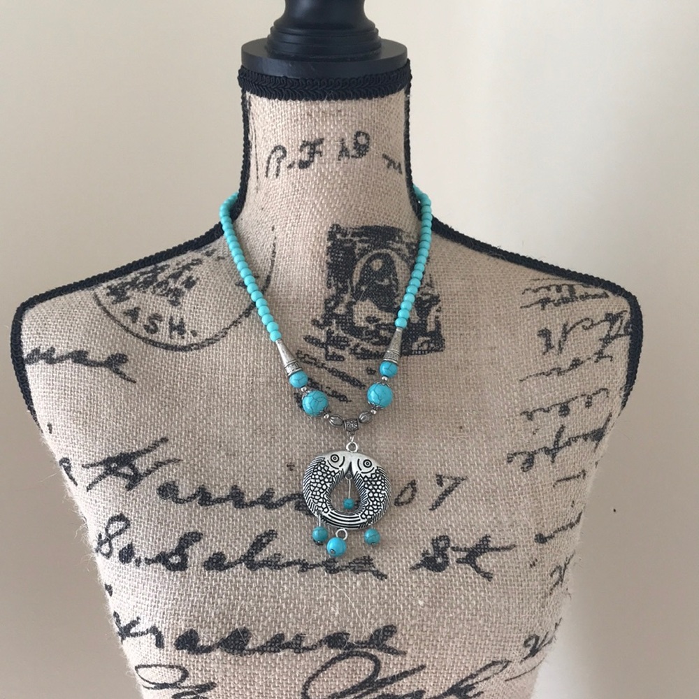 Fish necklace.